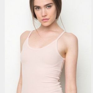 Small light pink Spanx workout top
